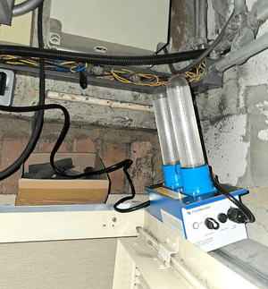 PurAire model FCU/2 installed in a hotel room fan coil space